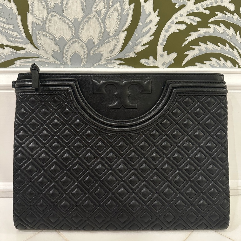 Black Tory Burch clutch. Roughly 12”x7”